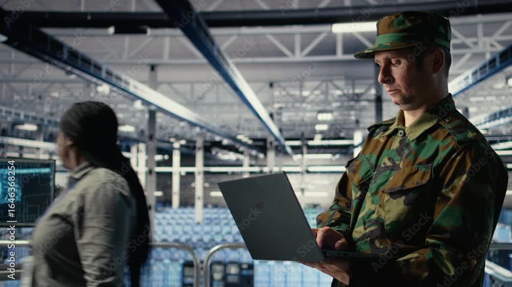 Poster army software developer in server hub uses artificial intelligence app on laptop to review reconnais