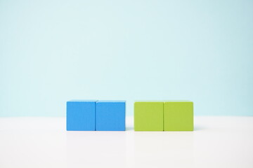 Colorful wooden blocks symbolizing concepts of balance and teamwork. strategy, business, economy and educational concepts