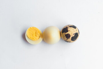Quail eggs on isolated white background (Telur Burung Puyuh)