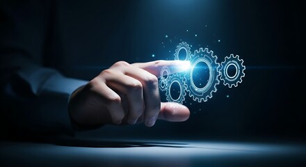 Automation and process concept. A hand touches a set of interlocking holographic gears, which start to rotate in sync, symbolizing automation.