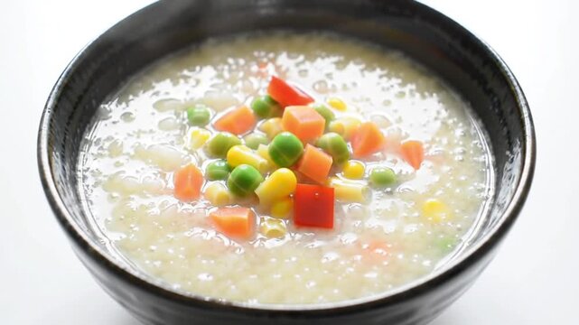 Steaming Bowl of Creamy Mixed Vegetable Congee Soup