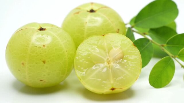 Fresh Sliced Indian Gooseberry (Amla) with Green Leaves
