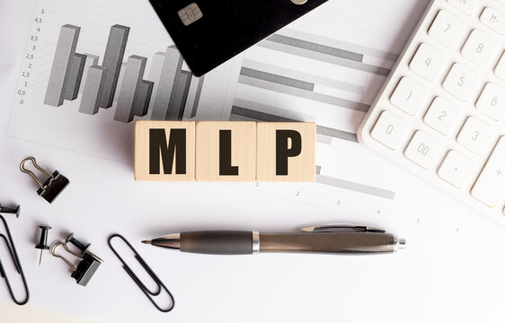 Wooden blocks with mlp text on desk with charts, credit card, coins, pen, calculator and office supplies