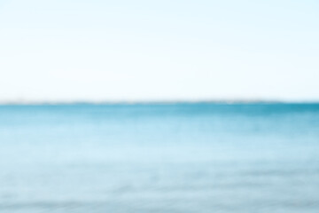 Beautiful sea under light blue sky, blurred view