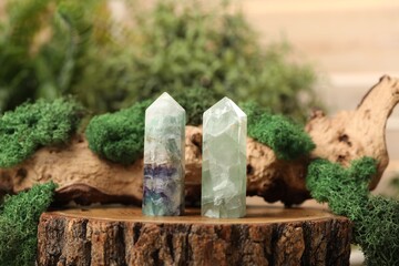 Aura. Beautiful crystals and driftwood with moss on stump