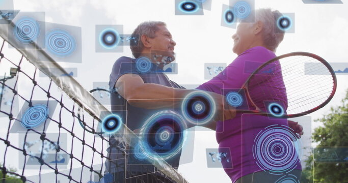 Leaning couple in sportswear embracing over tennis net on outdoor court, with digital overlays