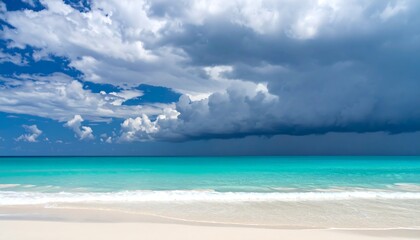 Fototapeta premium Tropical beach with storm clouds, and turquoise sea.
