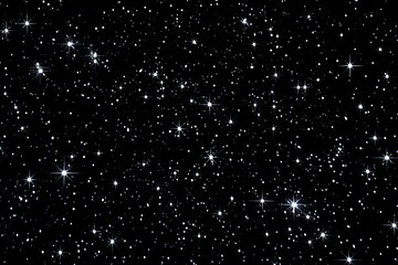 A dense field of twinkling stars against a deep black background.  Many small, bright stars,  some larger, more intense points of light,  scattered across the entire image