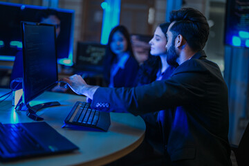 A diverse team of young AI engineers in a strategy meeting. Indian and East Asian colleagues discuss the next phase of development for a complex machine learning model in their lab.