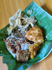Nasi pecel or sego pecel is a typical Javanese Indonesian rice dish served with pecel sauce, which...