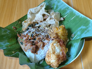 Nasi pecel or sego pecel is a typical Javanese Indonesian rice dish served with pecel sauce, which...