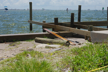 Coastal Dock Construction Site with Scenic WaterfrontBoca Ciega Bay View over large wood pole...