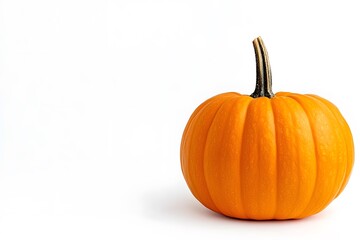 Obraz premium Small pumpkin on a white surface.