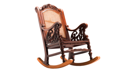 Ornate wooden rocking chair on black background.