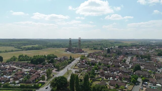 Aerial drone view of coal colliery mine site, industrial revolution legacy infrastructure extracting energy materials from earth Clipstone, Notttingham, England. 