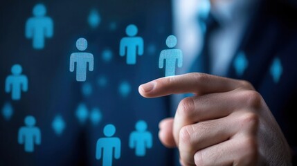 A hand pointing at a digital interface with blue human icons. The background is dark with blurred icons, suggesting a futuristic or digital environment. 