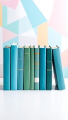 Fototapeta premium Teal and green books on white surface