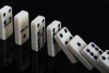 white domino blocks on black background