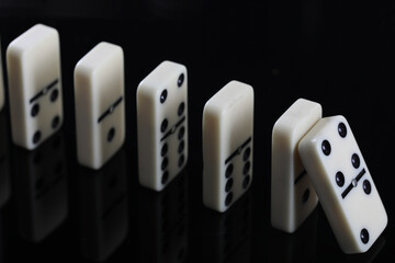 white domino blocks on black background