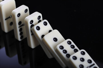 white domino blocks on black background