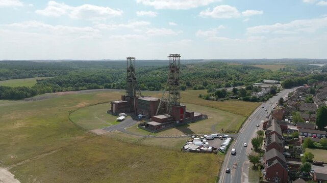 Aerial drone view of coal colliery mine site, industrial revolution legacy infrastructure extracting energy materials from earth Clipstone, Notttingham, England. 