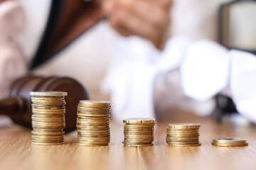 Coins on table of bankrupt businesswoman in office, closeup
