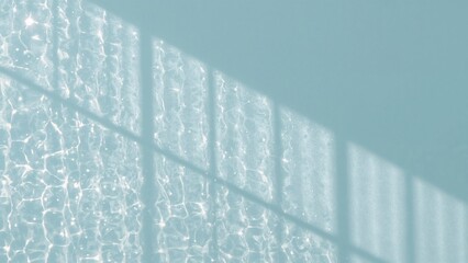 Dancing water reflections shimmering across teal wall surface, with window grid shadows