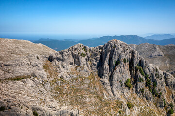 Drone aerial view of mountain peaks in Sardinia, Italy, near Sin