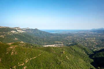 Drone aerial view of Baunei and Arabatax nestled amidst lush gre
