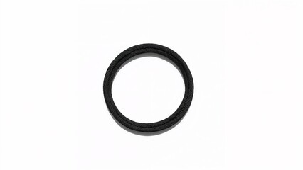 Highlighting braided black circular ring resting on white flat surface, showcasing woven texture
