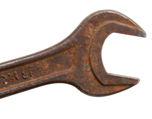 Angled Overhead View of Rusted Spanner Tool with Faded Markings, isolated on transparent background