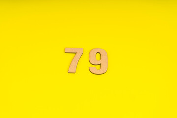 Number seventy-nine on yellow background