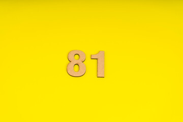 Number eighty-one on yellow background