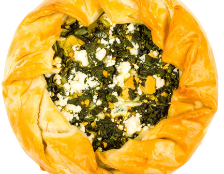 Savory spinach and feta cheese pie with a golden flaky phyllo pastry crust viewed from above. - Powered by Adobe