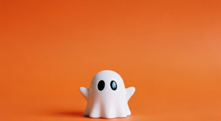 Adorable Ghost Decoration for Halloween Themed Content background ,camera angle ,orange background,  copy space