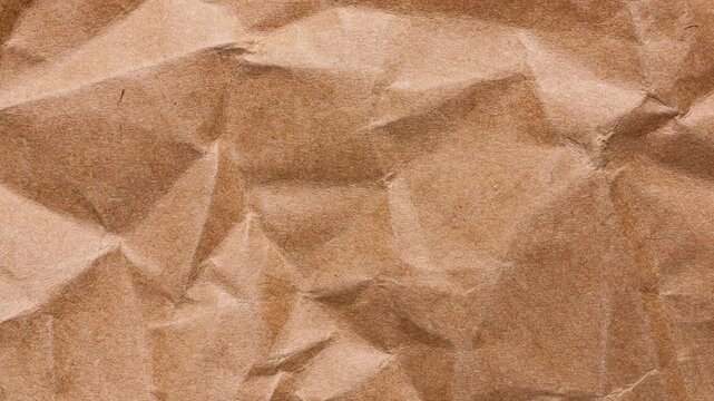 Stop motion loop of brown kraft wrapping sheet with pronounced creases