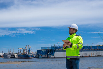 A specialist engineer is planning to expand a shipping port and install additional cranes.