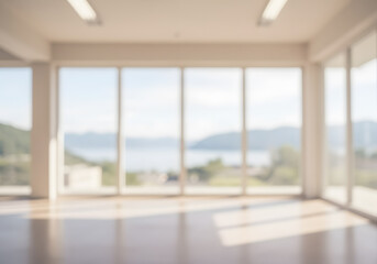 Fototapeta premium Blurred Modern Interior with Large Windows, Natural Light and Scenic Landscape View.