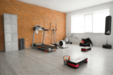 Blurred view of gym with sports equipment and locker