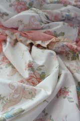 Soft floral fabric draped elegantly in natural light
