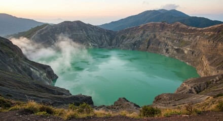 A vivid green volcanic crater lake is nestled within steep rocky cliffs, emitting soft steam into the cool morning air. Surrounding hills roll gently in the background, bathed in the early light of da