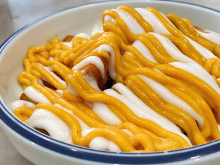 Cheesy potato wedges close up background. Stock photo.