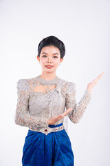 Portrait of Asian women with khmer traditional dress stand in front of pagoda with beautiful art...
