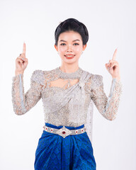 Portrait of Asian women with khmer traditional dress stand in front of pagoda with beautiful art...