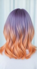 Naklejka premium Woman with purple and orange ombre dyed wavy hair, back view