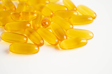 Fish oil or Cod liver oil gel in capsules with omega 3 vitamins, supplementary healthy food.
