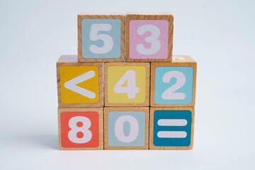Number wood block cubes for learning Mathematic, education math concept.