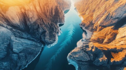 Aerial view of majestic canyon with river and rocky landscape