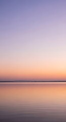 Obraz premium Harmonious Sunset Gradient Over Still Water: A Minimalist Horizon Reflecting Peaceful Twilight Colors, Inspiring Serenity and Balance