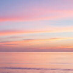 Fototapeta premium Pastel Sunset Over Calm Ocean Horizon, Reflecting Serenity and Natural Beauty with a Gentle Glow
